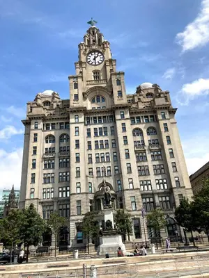 a building with a clock tower on top of it at Excelsior Apartments - Liverpool Central - Free Parking - AirCon in Liverpool