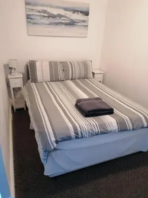 a large bed in a room with at The Kirkview in Blackpool