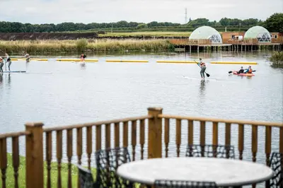 a group of people on boats on the water at Ream Hills Holiday Park in Blackpool