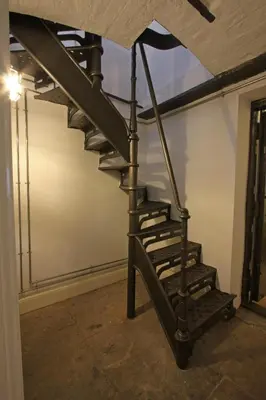 a spiral staircase in a room with a ceiling at The Castle Collection - 25 Castle Street in Liverpool