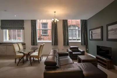 a living room with a couch and a table at The Castle Collection - 25 Castle Street in Liverpool