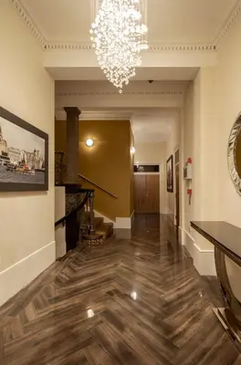 a hallway with a chandelier in a building at The Castle Collection - 25 Castle Street in Liverpool