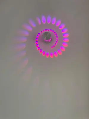 a purple mirror with a ring on top of it at San Remo Apartments Blackpool in Blackpool