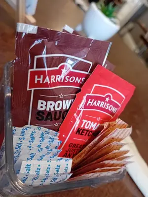 a table with two boxes of brown savory snacks at The Beckwood Hotel in Blackpool