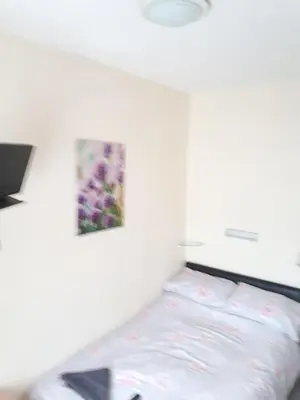 a bed in a room with a picture on the wall at Montgomery Hotel in Blackpool