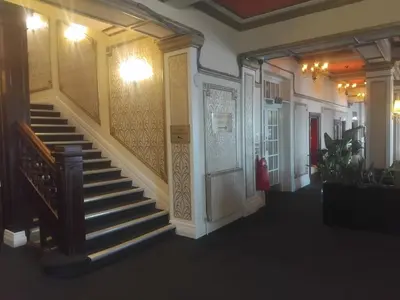 a hallway with a staircase in a building at The Savoy Hotel in Blackpool