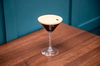 a wine glass sitting on top of a wooden table at Knowsley Inn & Lounge in Knowsley