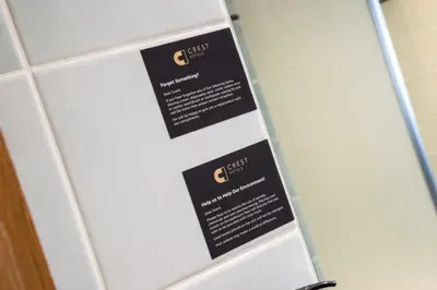 a white refrigerator with two black signs on it at Knowsley Inn & Lounge in Knowsley