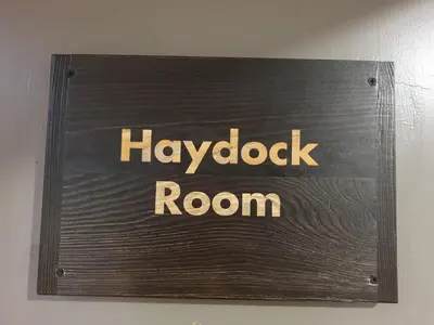 a sign for a napoda room on a wall at Knowsley Inn & Lounge in Knowsley
