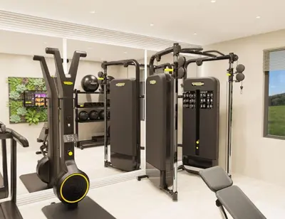 a gym with treadmills and machines in a room at Knowsley Inn & Lounge in Knowsley