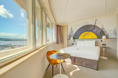 a hotel room with a bed and a large window at Atlantic Tower Hotel Liverpool By Sunday in Liverpool