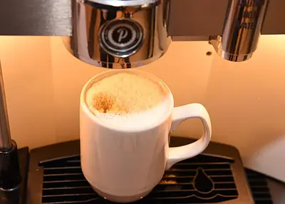 a cup of coffee sitting on top of a counter at Holiday Inn Express Liverpool-Albert Dock by IHG in Liverpool