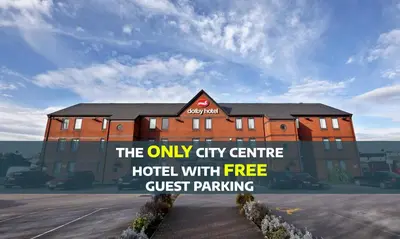 a hotel with a sign that reads the only city centre hotel with free guest parking at The Dolby Hotel Liverpool - Free city centre parking in Liverpool