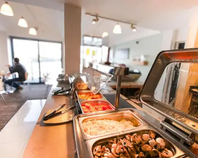 a buffet line with many trays of food at The Dolby Hotel Liverpool - Free city centre parking in Liverpool