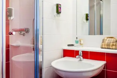 a bathroom with a sink and a shower at Forshaws Hotel - Blackpool in Blackpool