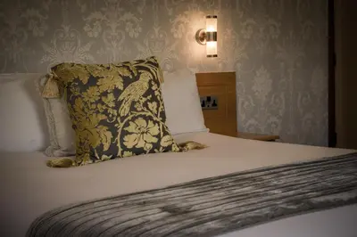 a bed with a pillow on top of it at Shard Riverside in Poulton le Fylde