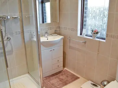 a bathroom with a sink and a shower at Marstan House in Standish