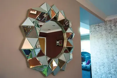 a mirror hanging on a wall in a room at The Avenue Hotel Ltd in Clitheroe