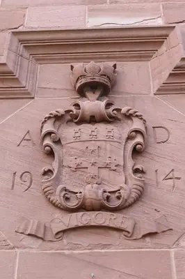 a stone sign on the side of a building at Abbey House Hotel in Barrow in Furness