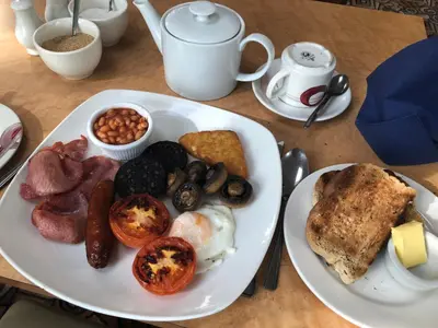 a plate of breakfast food on a table at Calf's Head Hotel in Clitheroe
