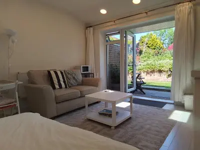 a living room with a couch and a table at Holland House in New Brighton