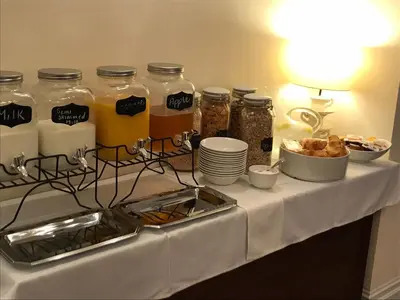 a table with jars of honey and other food at The Windsor Carlton in Blackpool