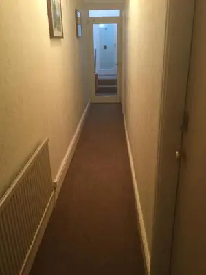 a hallway with a hallway leading into a room at The Windsor Carlton in Blackpool