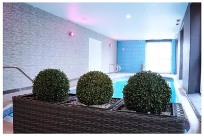 a bath tub with four bushes in a room at Bluewaters Hotel, Blackpool North Promenade in Blackpool