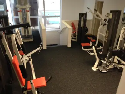 a gym with a bunch of exercise equipment in it at Inn On The Prom At The Fernlea Hotel in Lytham St Annes