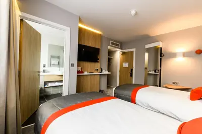 two beds in a hotel room at Holiday Inn Express - Wigan by IHG in Wigan