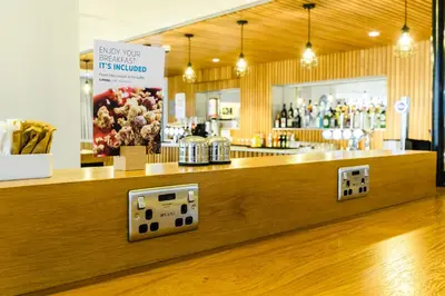 a counter in a store with a counter sidx sidx sidx at Holiday Inn Express - Wigan by IHG in Wigan