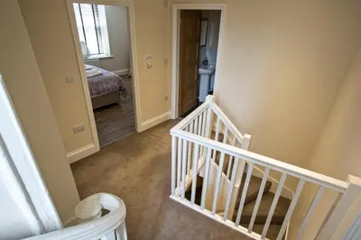 an empty hallway with a staircase in a house at Cider House in Ulverston