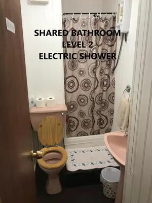 a bathroom with a sink and a toilet and a shower at Coco Beach Hotel in Blackpool