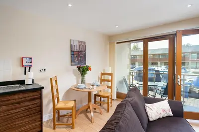 a living room with a couch and a table at Tewitfield Marina in Carnforth