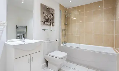 a bathroom with a toilet and a sink and a shower at Tewitfield Marina in Carnforth