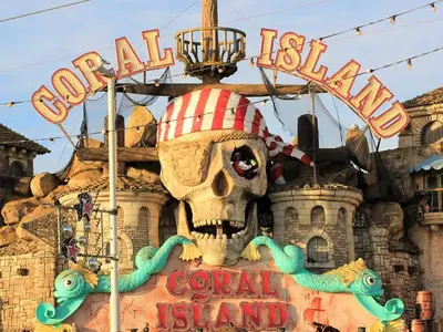 a sign in front of the disneyland resort at Seagull Hotel in Blackpool