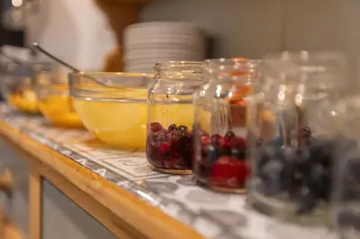 a counter with jars of fruit and bowls of oranges at The Fairmile in Lytham St Annes