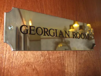 a sign on a door that says georgian room at The Lonsdale in Blackpool