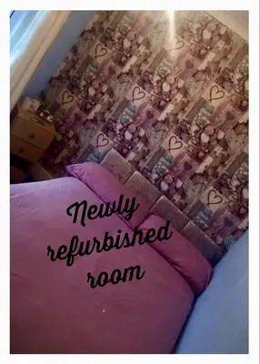 a bed with a purple pillow with the words newly reinvented room at The Galloway in Blackpool