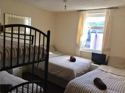 a bedroom with two bunk beds and a window at The Galloway in Blackpool
