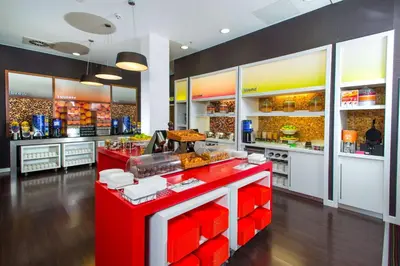 a fast food restaurant with a red counter top at Hampton By Hilton Liverpool City Centre in Liverpool
