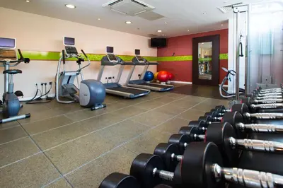 a gym with lots of treadmills and machines at Hampton By Hilton Liverpool City Centre in Liverpool