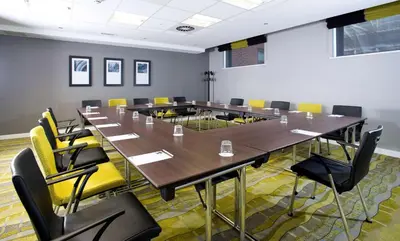 a conference room with a long table and chairs at Hampton By Hilton Liverpool City Centre in Liverpool