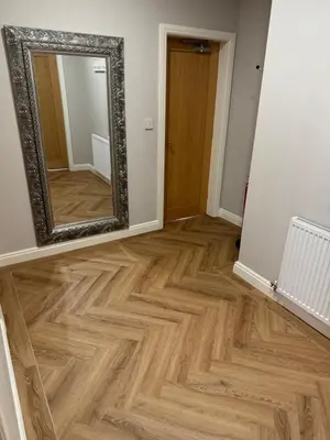 a hallway with a mirror and a wooden floor at Beach House Apartment on ground floor with sea view - pet friendly in Cleveleys