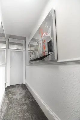 a white room with a painting on the wall at Clifton Villa - Southport in Southport