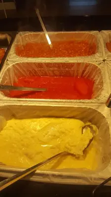 three plastic containers filled with different types of food at Queens Plaza Hotel in Blackpool