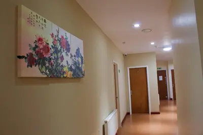 a hallway with a painting on the wall at Renshaw Guest House in Liverpool