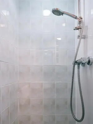a shower with a shower head in a bathroom at The Queens Hotel in Lytham St Annes
