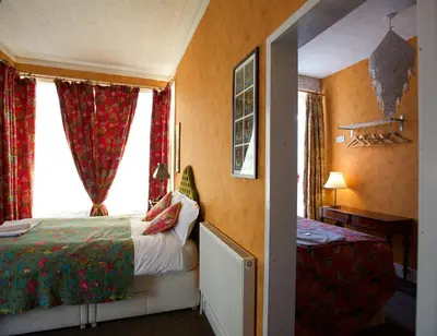 a hotel room with a bed and a window at The Gallery in Blackpool