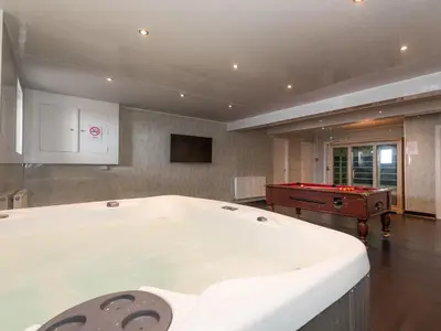 a large room with a pool table and a pool table at Ocean View House in Blackpool